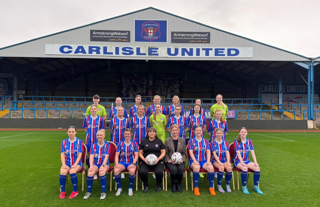 Hannah Smith (centre, right), Partner at Bendles Solicitors, with Tracy Gannon (centre, left), Manager of Carlisle United Ladies, and the Carlisle United Ladies team